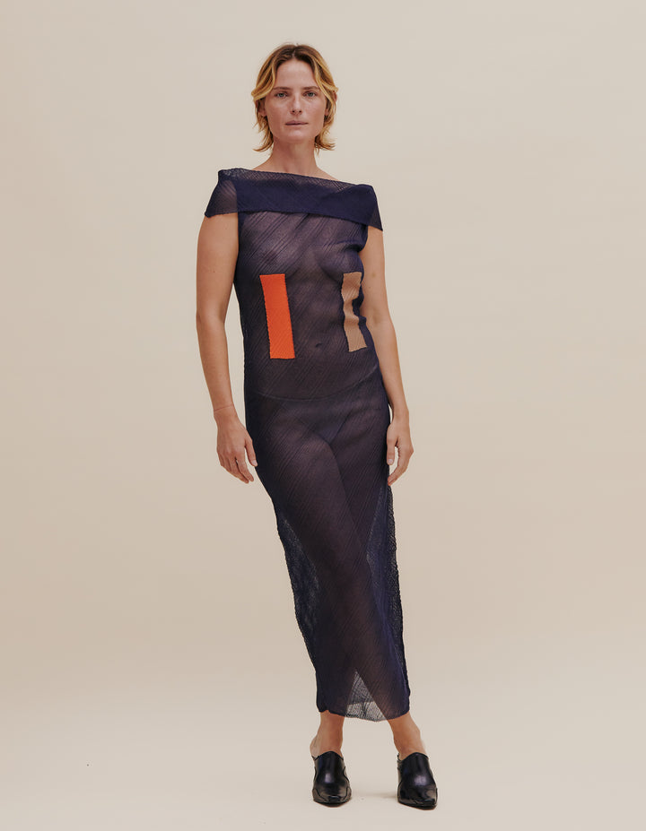 Seamlessly fully-fashioned sheer knit column dress with foldover detail at the shoulders. Made from a polyester monofilament Italian yarn, with contrasting intarsia color blocking on the front torso. Model wears size S. 100% polyester. Made in USA.