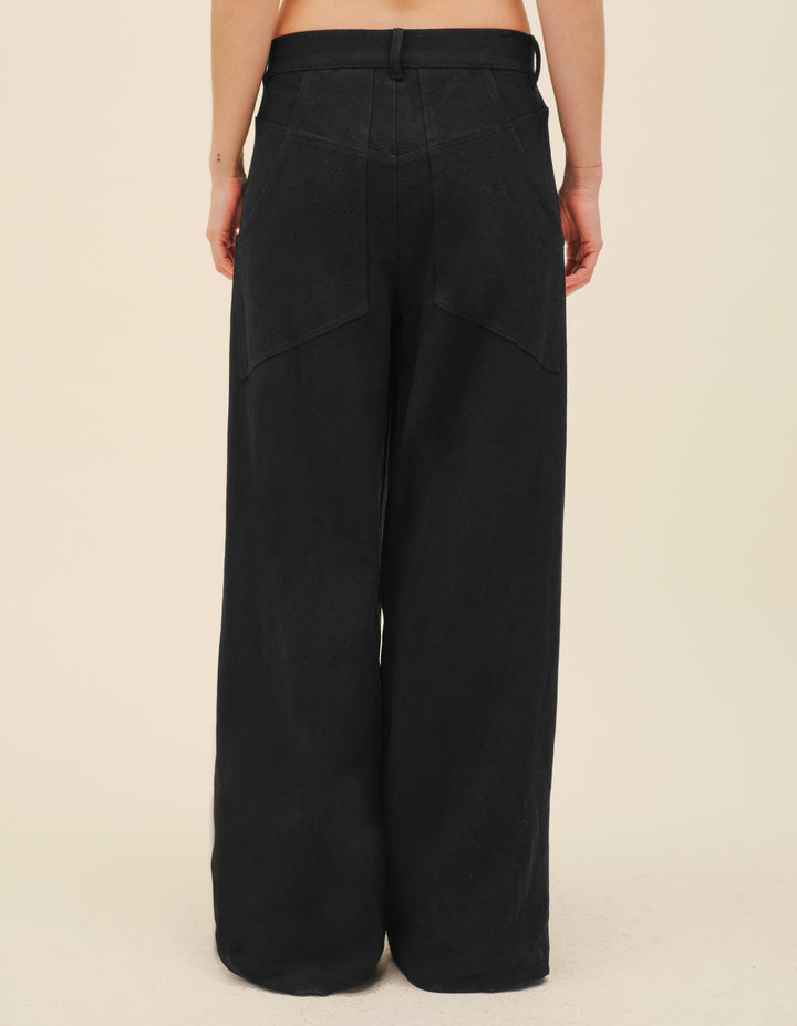 These pleated trousers are cut in a textured cotton linen blend. Complete with a concealed fly and side seam pockets, and inverted box pleats at the front waist. Made in Portugal. 55% linen, 45% cotton. Models wear sizes small and medium.