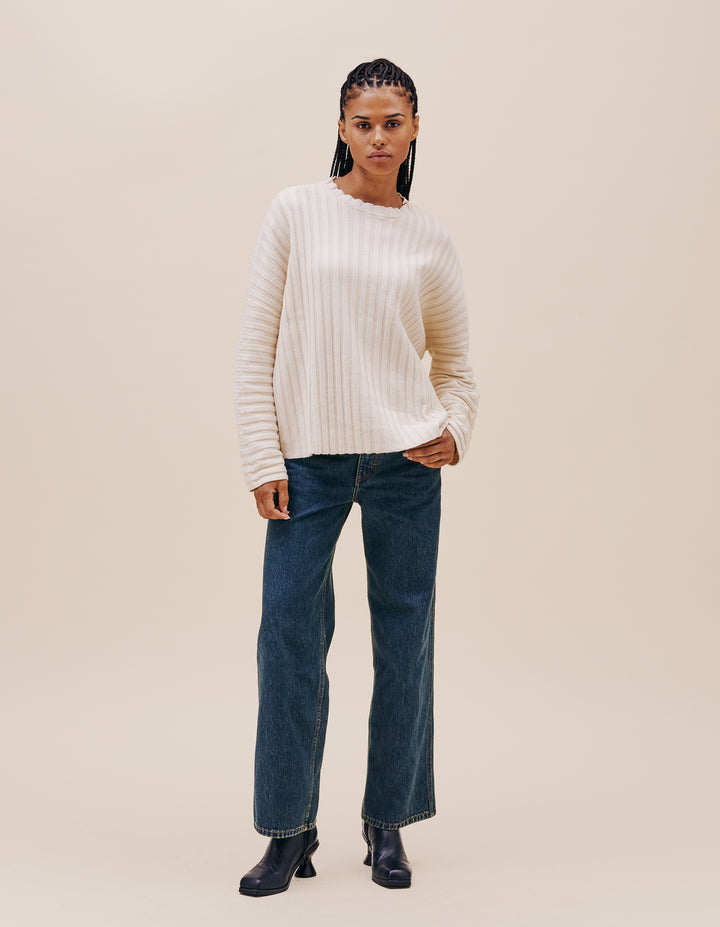 Our classic unisex dolman crewneck sweater is knit with a plated rib in a dry linen/cotton blend. Wide ribs accordion open and collapse as the sweater falls slightly cropped at the hip. 55% linen, 45% cotton. Made in China. Models wear size medium.