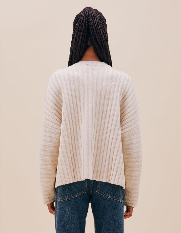 Our classic unisex dolman crewneck sweater is knit with a plated rib in a dry linen/cotton blend. Wide ribs accordion open and collapse as the sweater falls slightly cropped at the hip. 55% linen, 45% cotton. Made in China. Models wear size medium.