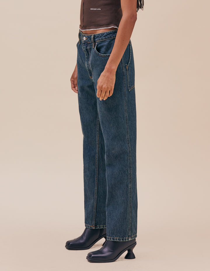 Our new straight leg jean has an updated fit with a lower rise. This pair features in our “New Blue” enzyme wash with over-dyed indigo. Complete with our signature back pockets and nickel hardware. The inseam for sizes 24-29 is 30” and for 30-36 is 32”. Models wear sizes 27 and 30. Made in USA. 100% cotton.