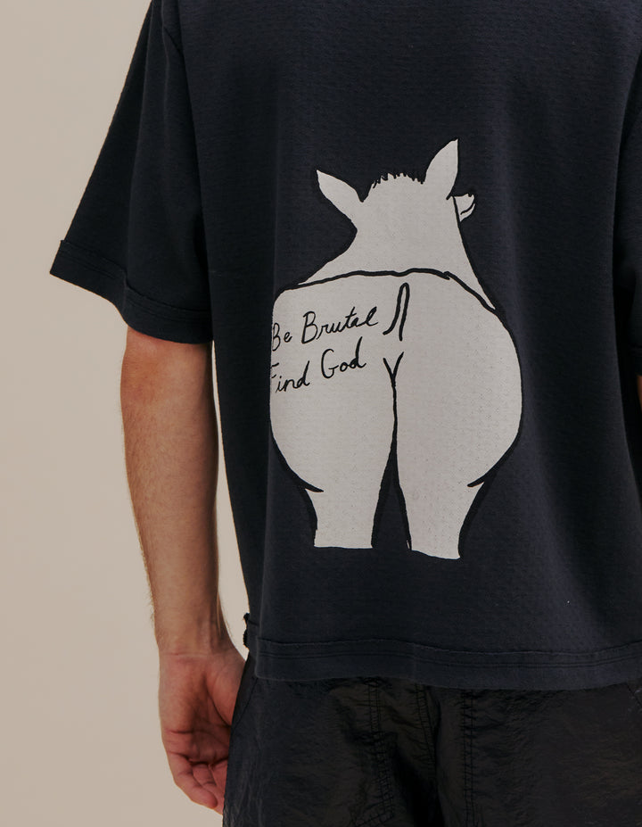 Relaxed-fit tee in a weighty pointelle rib stretch cotton. Garment dyed. Chihuahua screenprint on both sides with words “Be Brutal Find God” on back. Models wear sizes S and L. 100% cotton. Made in Peru.