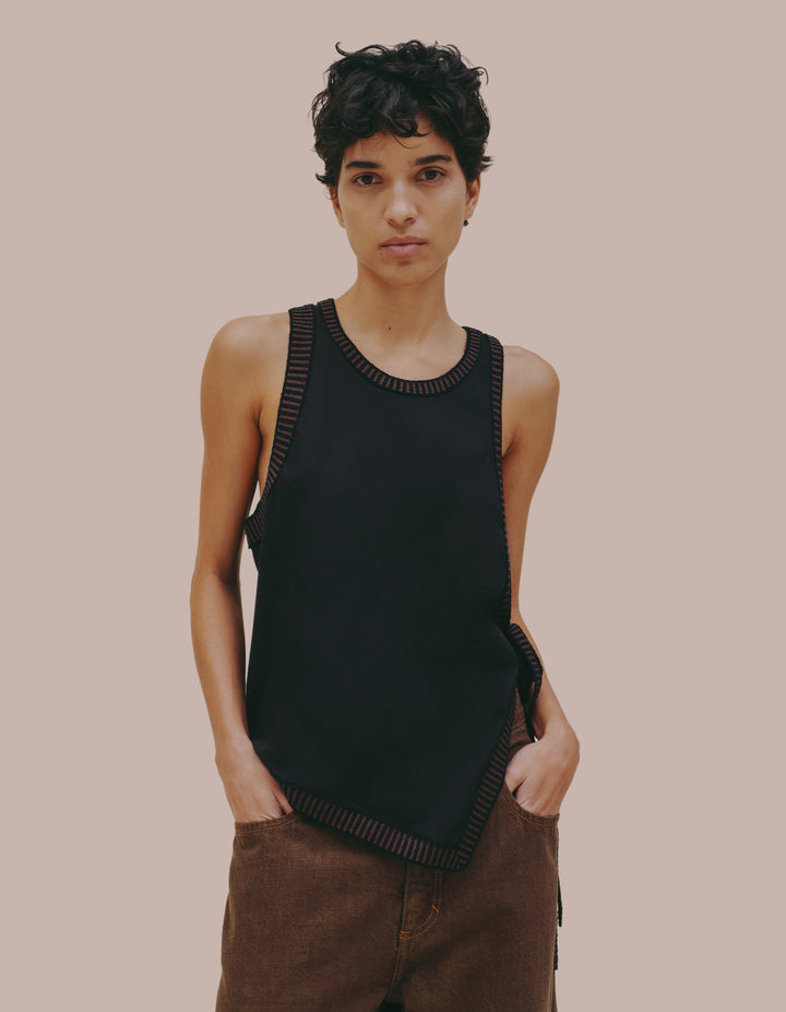 Eckhaus Latta black tank top with tie.