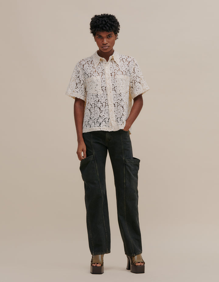 Italian floral lace boxy-fit short sleeve button down. Detailed with exaggerated collar points and two patch pockets at the chest. Models wear size M. 55% cotton, 27% nylon, 18% viscose. Made in China.