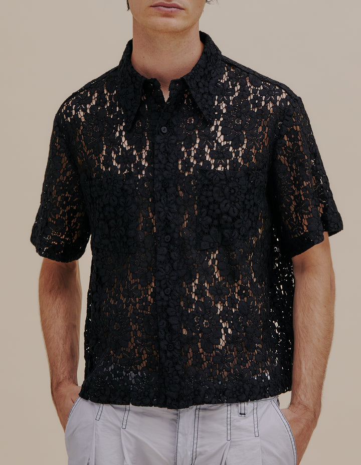 Italian floral lace boxy-fit short sleeve button down. Detailed with exaggerated collar points and two patch pockets at the chest. Model wears size M. 55% cotton, 27% nylon, 18% viscose. Made in China.