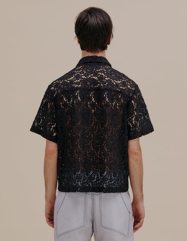 Italian floral lace boxy-fit short sleeve button down. Detailed with exaggerated collar points and two patch pockets at the chest. Model wears size M. 55% cotton, 27% nylon, 18% viscose. Made in China.