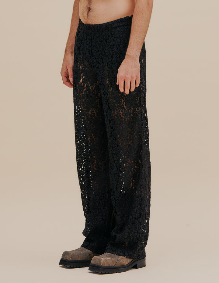 Italian floral lace pant with a detachable three-quarter length skirt layer, complete with an adjustable belt and slider. This pant has a natural rise with a straight leg and side seam pockets. Models wear size S. 55% cotton, 27% nylon, 18% viscose. Made in China. This style runs large, we suggest sizing down.