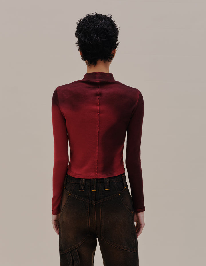 LAPPED BABY TURTLENECK IN MAROON BLUR