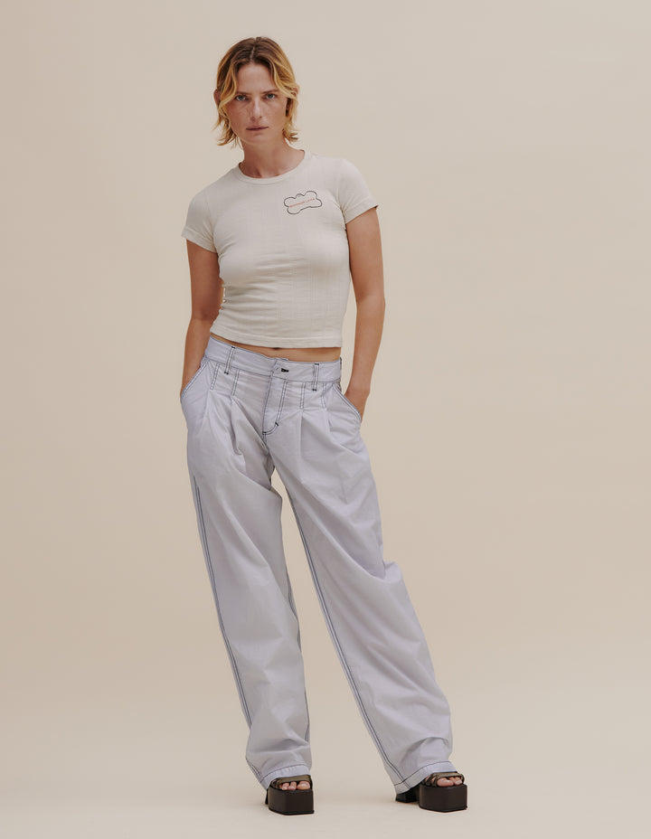 Pleated wide leg pant made from an Italian coated nylon with a subtle sheen. Unlined, with felled seams throughout. Finished with our signature EL back pockets and black topstitching. Models wear sizes 27 and 30. 60% nylon, 40% polyurethane. Made in USA.