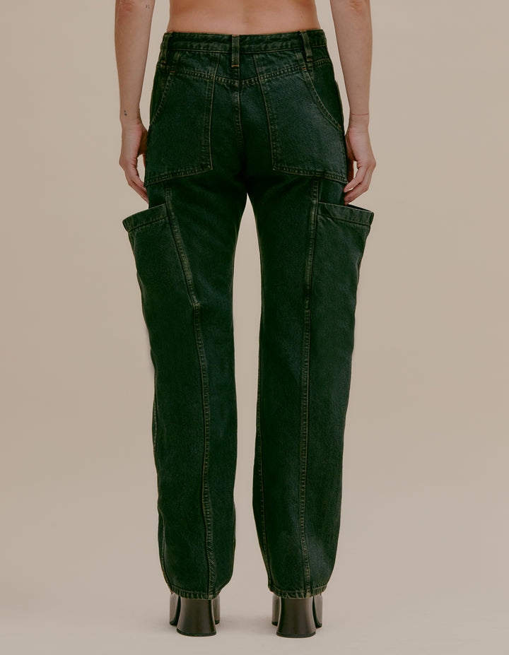 An exclusive new style jean in a mid-rise straight leg with an exaggerated cargo pocket detail. Tinted stonewash in deep green Pine colorway. Our signature pockets at the back and finished with nickel hardware. Models wear sizes 27 and 30. 100% cotton. Made in USA.